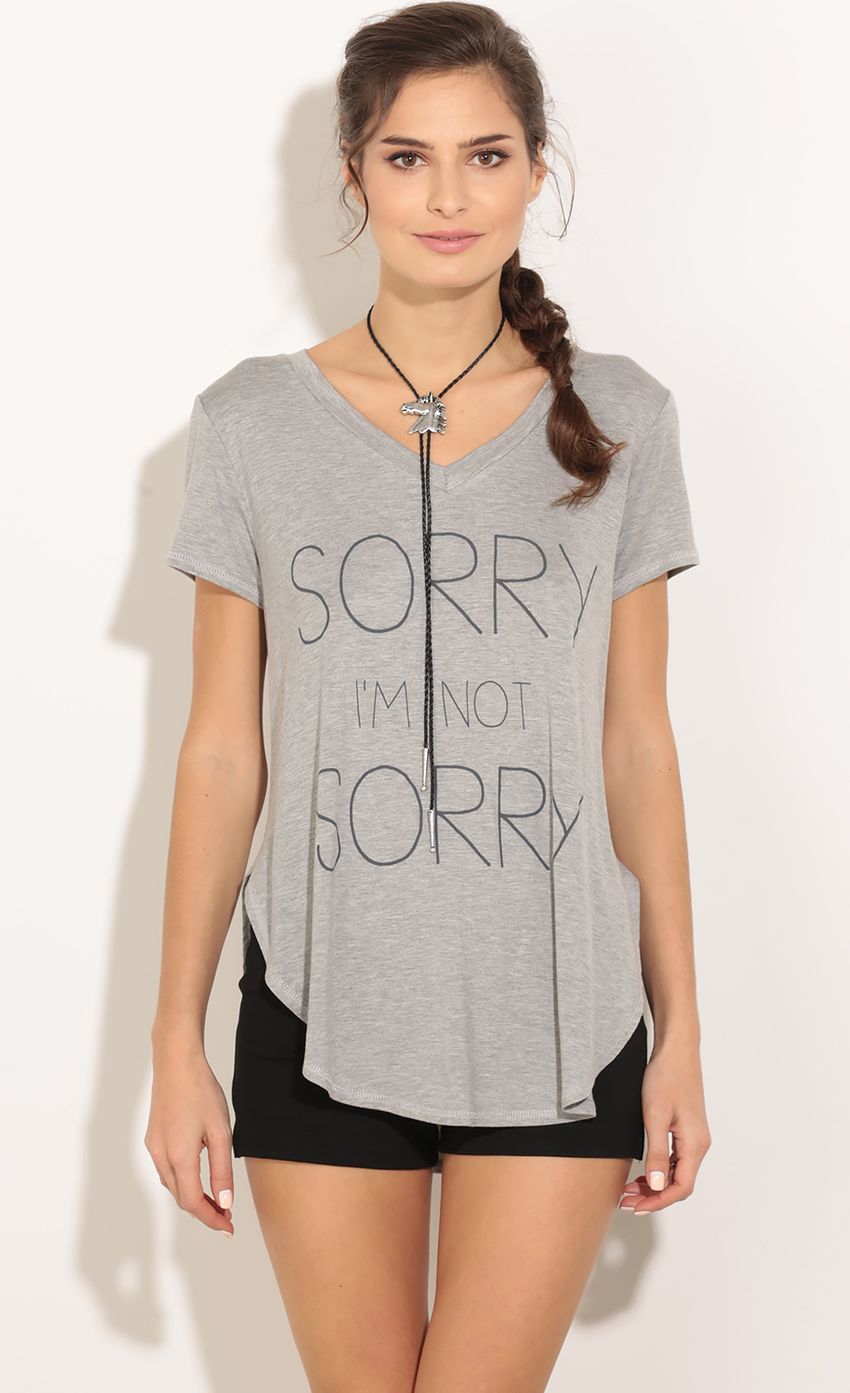 Picture Sorry I'm Not Sorry Graphic Top In Grey. Source: https://media-img.lucyinthesky.com/data/Jan16_1/850xAUTO/0Y5A6396.JPG