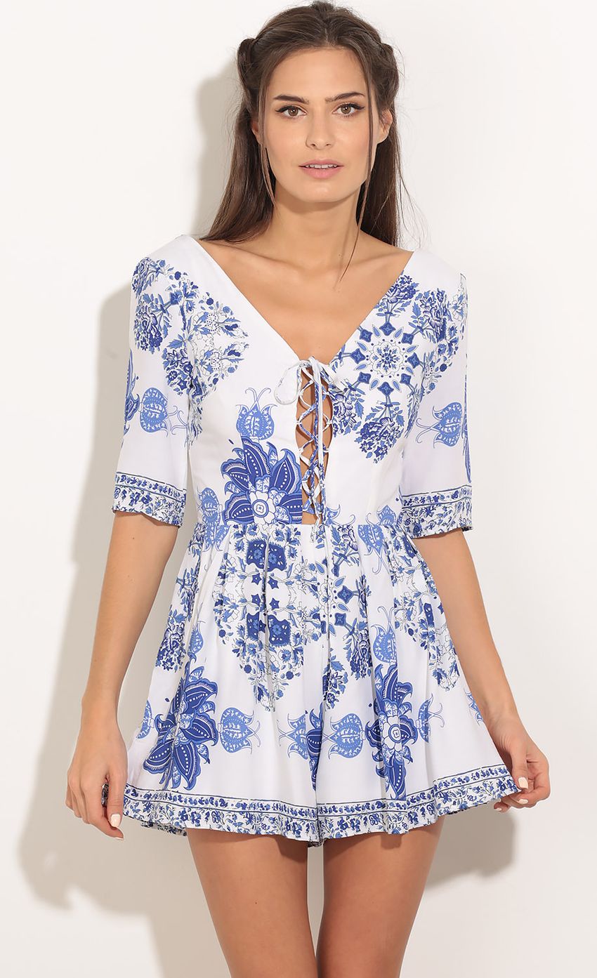 Picture Floral Burst Romper In Blue. Source: https://media-img.lucyinthesky.com/data/Jan16_2/850xAUTO/0Y5A4543.JPG