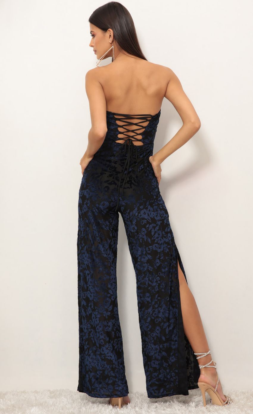 Picture Carina Cutout Jumpsuit in Navy Burnout Velvet. Source: https://media-img.lucyinthesky.com/data/Jan19_1/850xAUTO/0Y5A9299.JPG