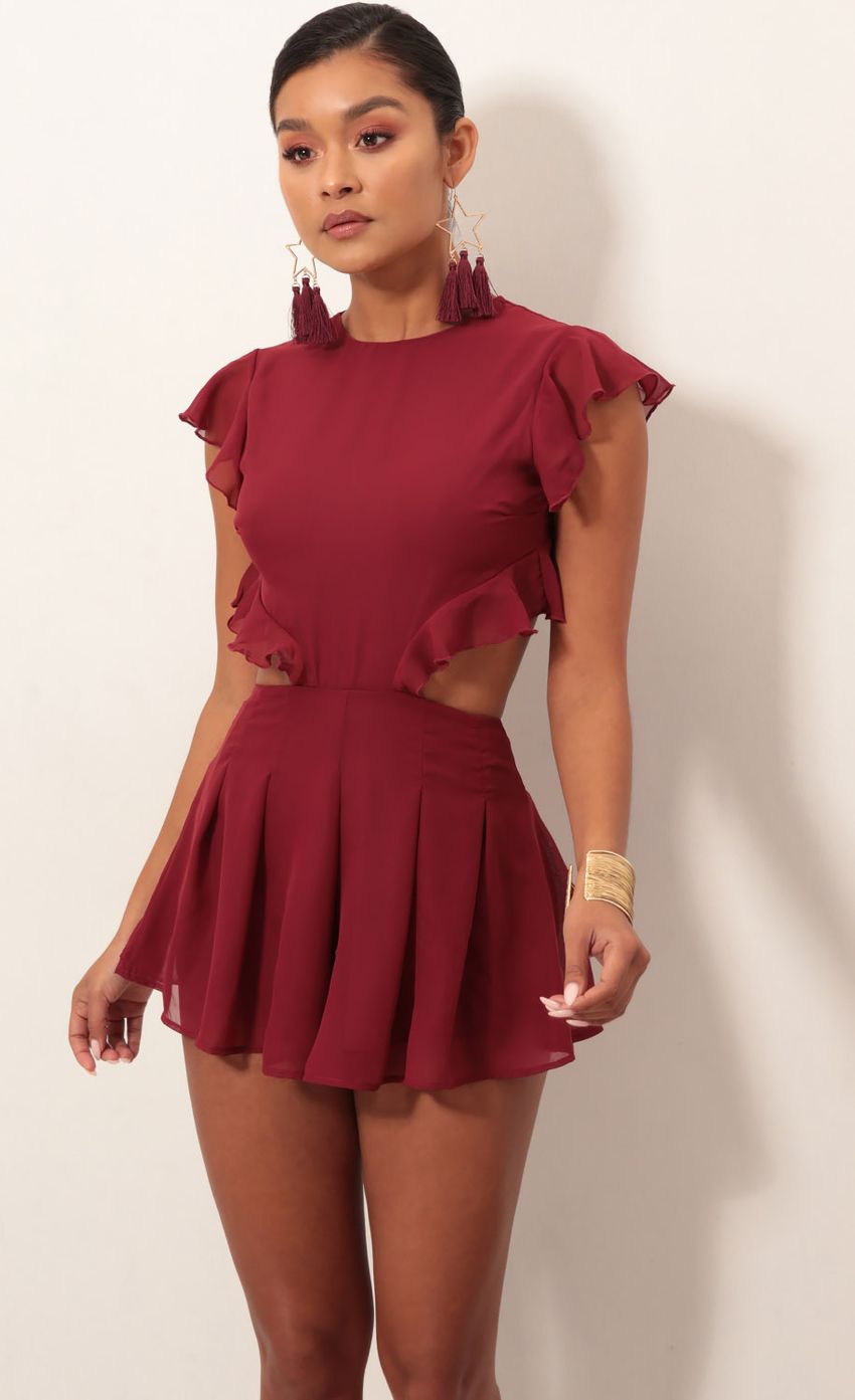 Picture Kara Cutout Romper in Maroon. Source: https://media-img.lucyinthesky.com/data/Jan19_2/850xAUTO/0Y5A2929S.JPG