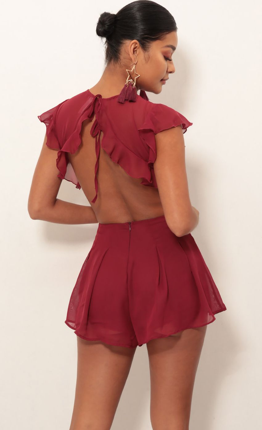 Picture Kara Cutout Romper in Maroon. Source: https://media-img.lucyinthesky.com/data/Jan19_2/850xAUTO/0Y5A2957.JPG