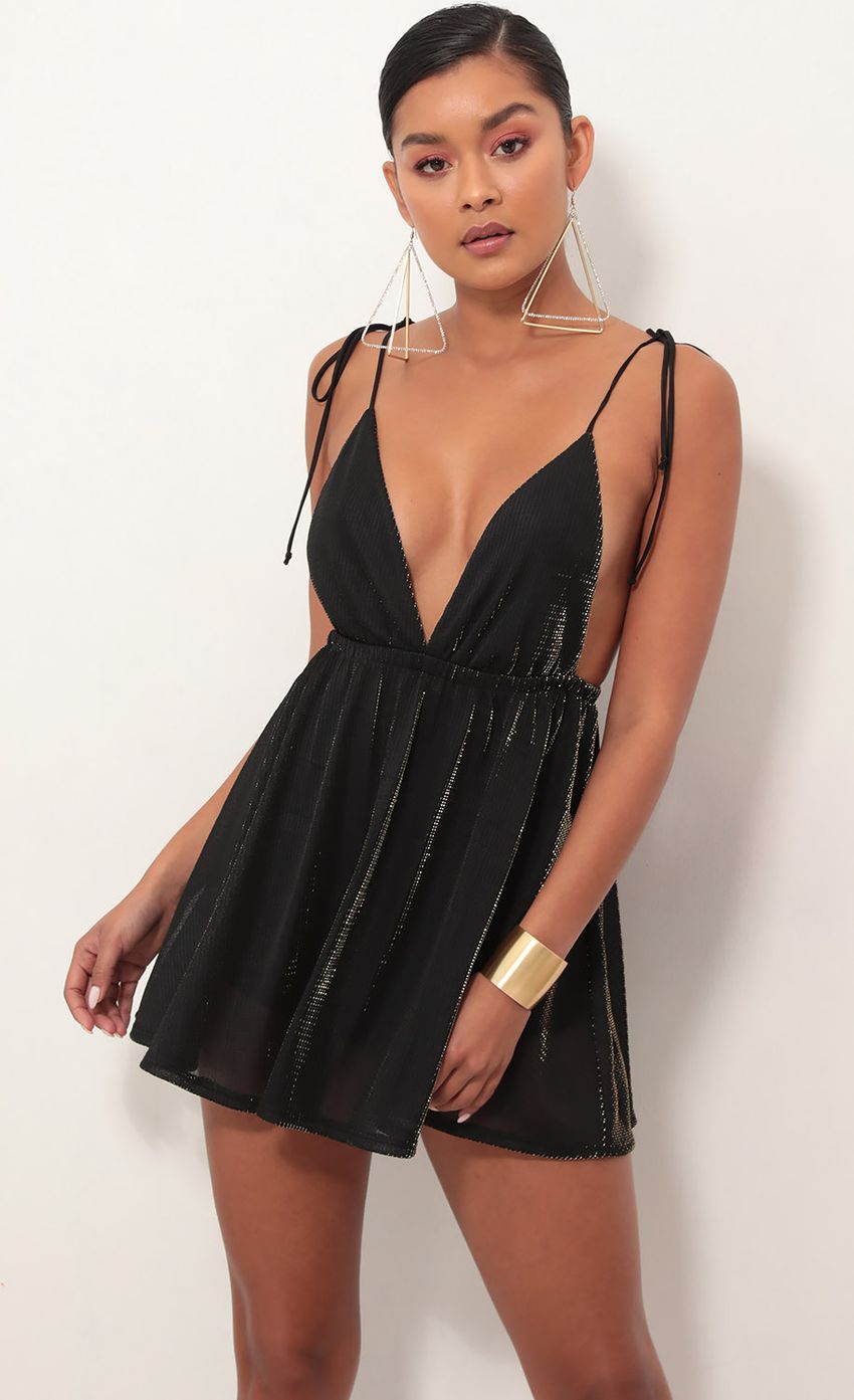 Picture Skye Shoulder Tie Dress in Black Gold. Source: https://media-img.lucyinthesky.com/data/Jan19_2/850xAUTO/781A5771S.JPG