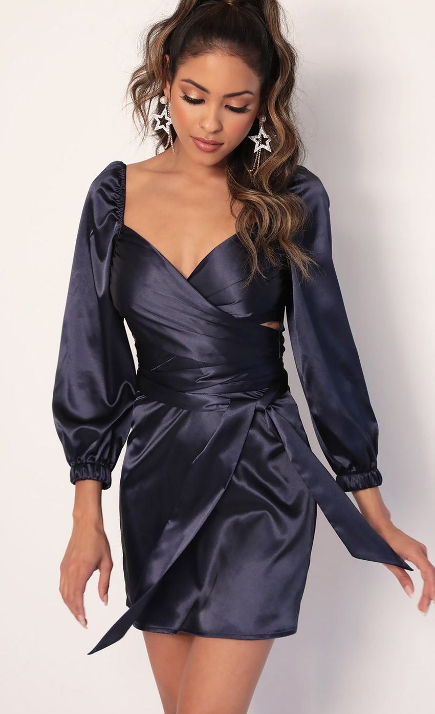 Picture Puff Sleeve Wrap Dress in Navy. Source: https://media-img.lucyinthesky.com/data/Jan20_1/850xAUTO/781A4309.JPG