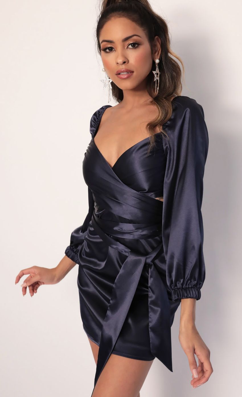 Picture Puff Sleeve Wrap Dress in Navy. Source: https://media-img.lucyinthesky.com/data/Jan20_1/850xAUTO/781A4370.JPG