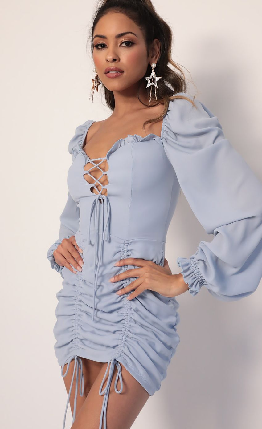 Picture Couture Puff Sleeve Dress in Dusty Blue. Source: https://media-img.lucyinthesky.com/data/Jan20_1/850xAUTO/781A4442.JPG