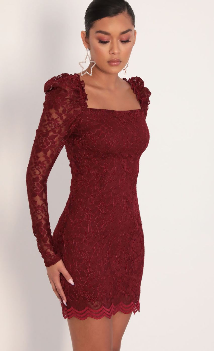 Picture Elisa Puff Sleeve Lace Dress in Merlot. Source: https://media-img.lucyinthesky.com/data/Jan20_2/850xAUTO/781A0950.JPG