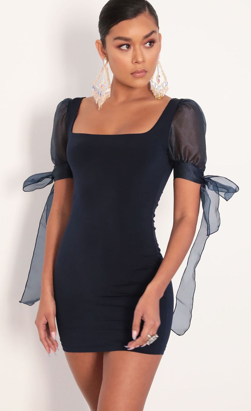 Picture Amelie Chiffon Ties Puff Dress in Navy. Source: https://media-img.lucyinthesky.com/data/Jan20_2/850xAUTO/781A7011.JPG