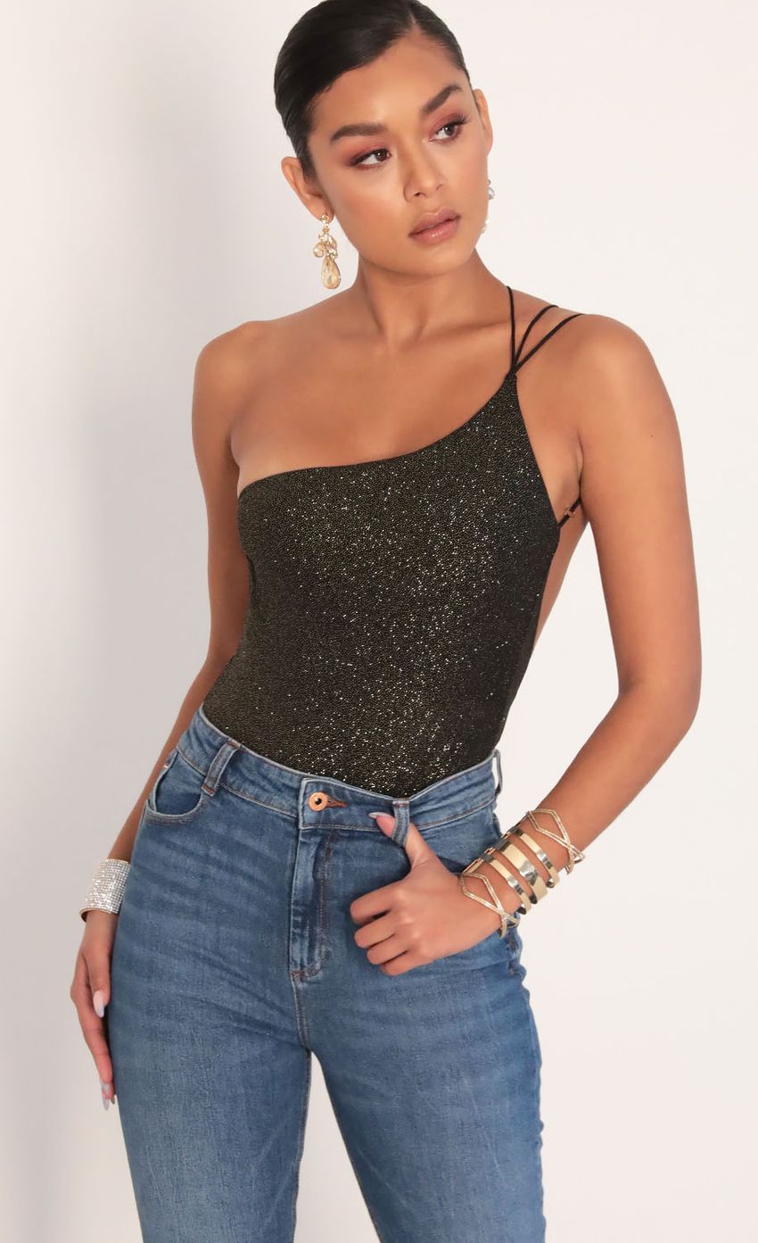 Picture Late Night Sparkling Bodysuit in Black Gold. Source: https://media-img.lucyinthesky.com/data/Jan20_2/850xAUTO/781A8924.JPG