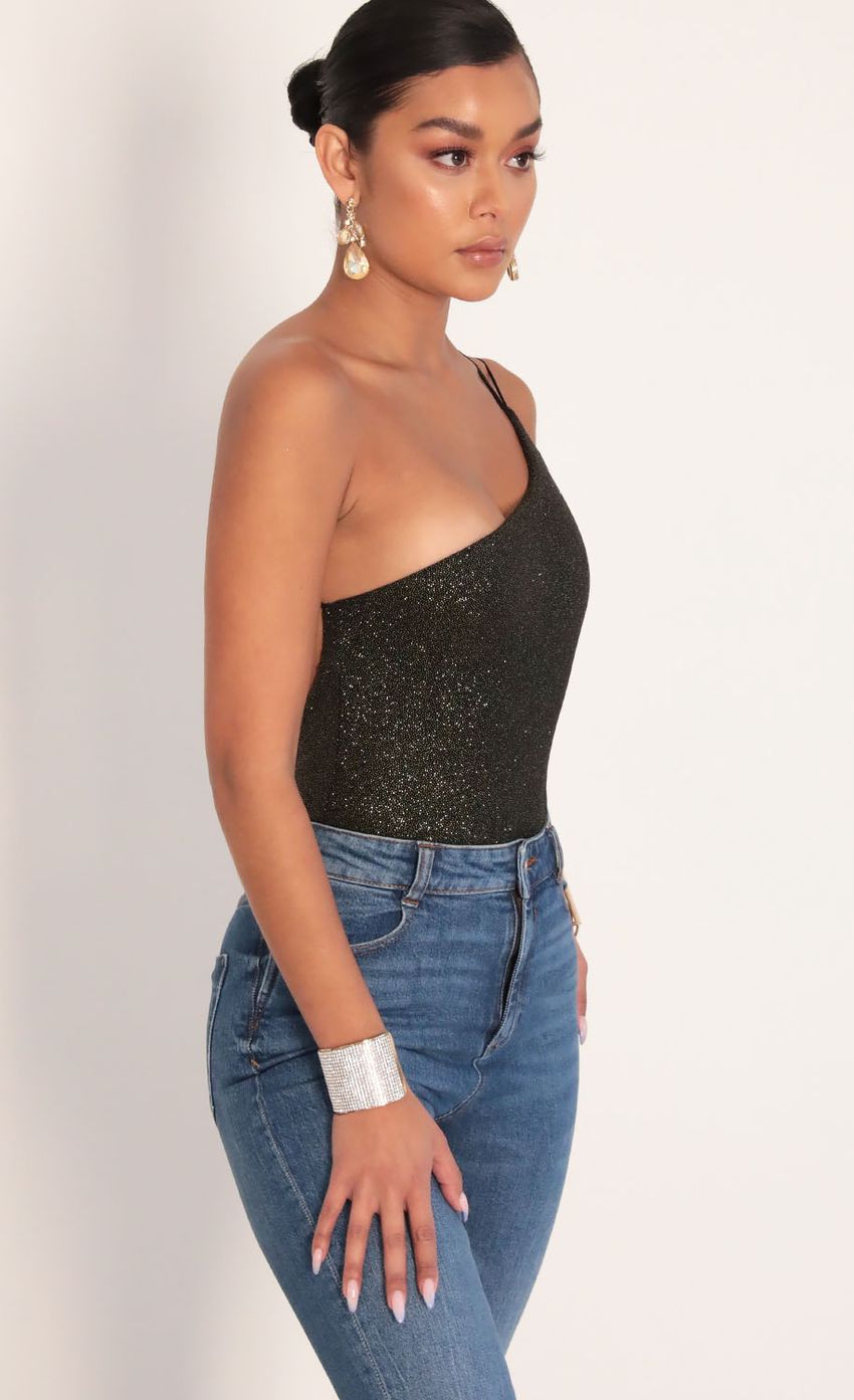 Picture Late Night Sparkling Bodysuit in Black Gold. Source: https://media-img.lucyinthesky.com/data/Jan20_2/850xAUTO/781A8949.JPG
