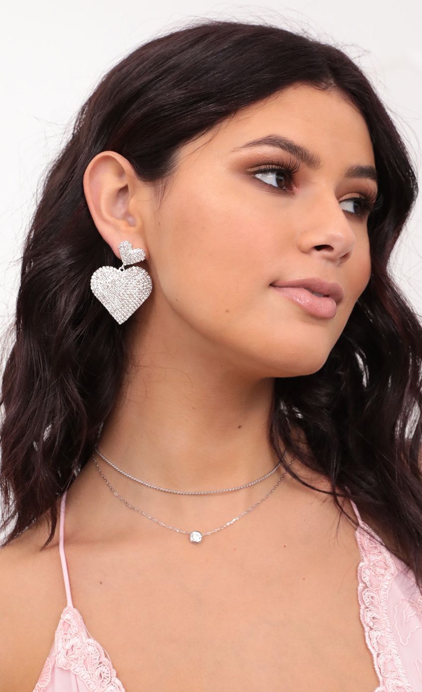 Picture Shine Bright Heart Earrings in Silver. Source: https://media-img.lucyinthesky.com/data/Jan21_2/850xAUTO/1V9A5073.JPG