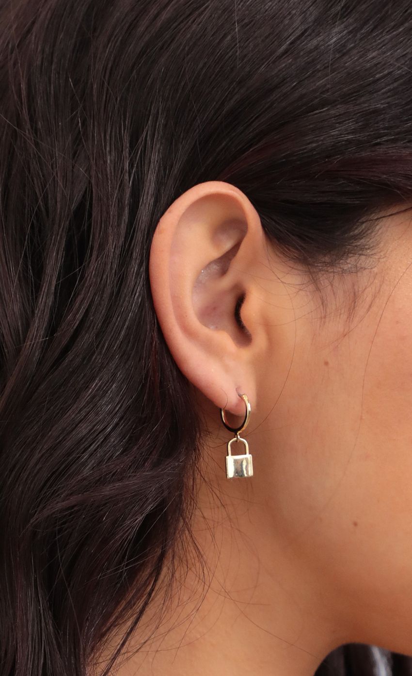 Picture Lock to my Heart Mini Hoop Earrings in Gold. Source: https://media-img.lucyinthesky.com/data/Jan21_2/850xAUTO/AT2A0347.JPG