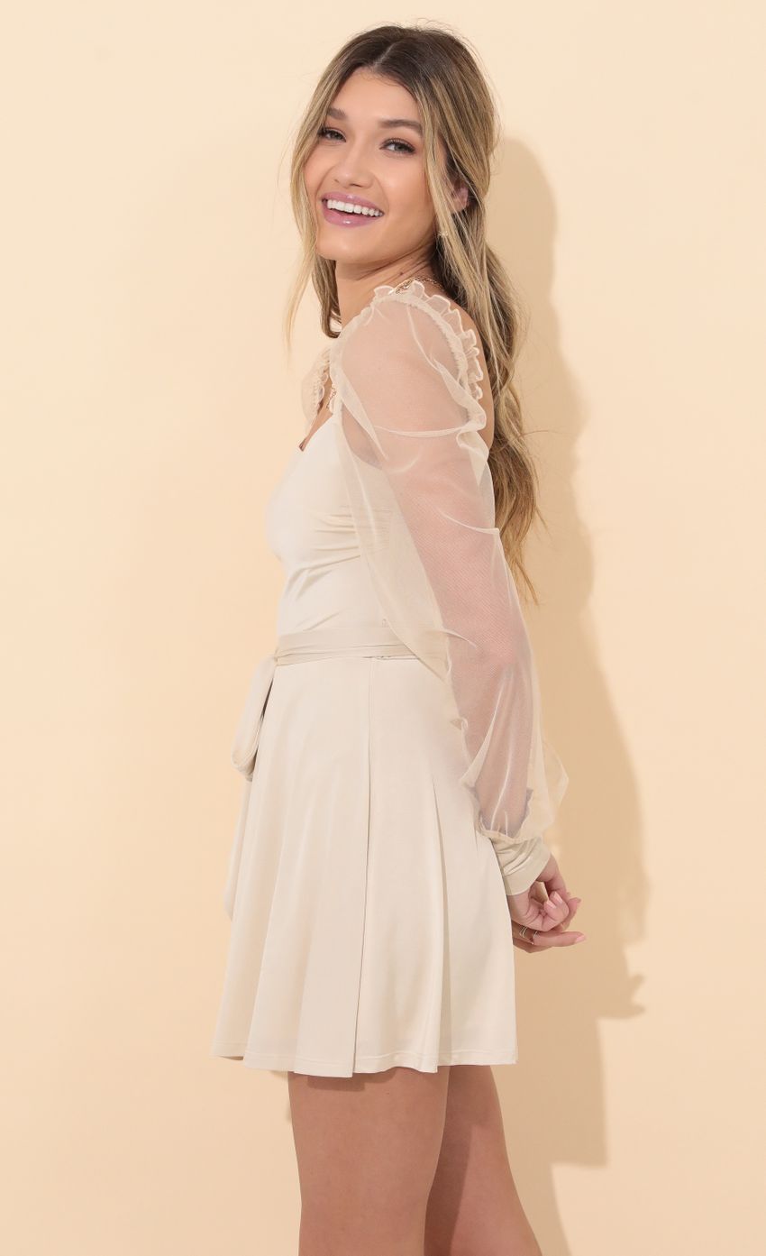 Picture Long Sleeve Dress in Champagne. Source: https://media-img.lucyinthesky.com/data/Jan22_1/850xAUTO/1V9A3951.JPG