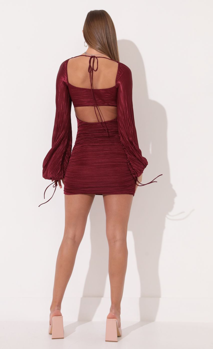 Picture Pleated Long Sleeve Dress in Ruby. Source: https://media-img.lucyinthesky.com/data/Jan22_2/850xAUTO/1V9A12761.JPG
