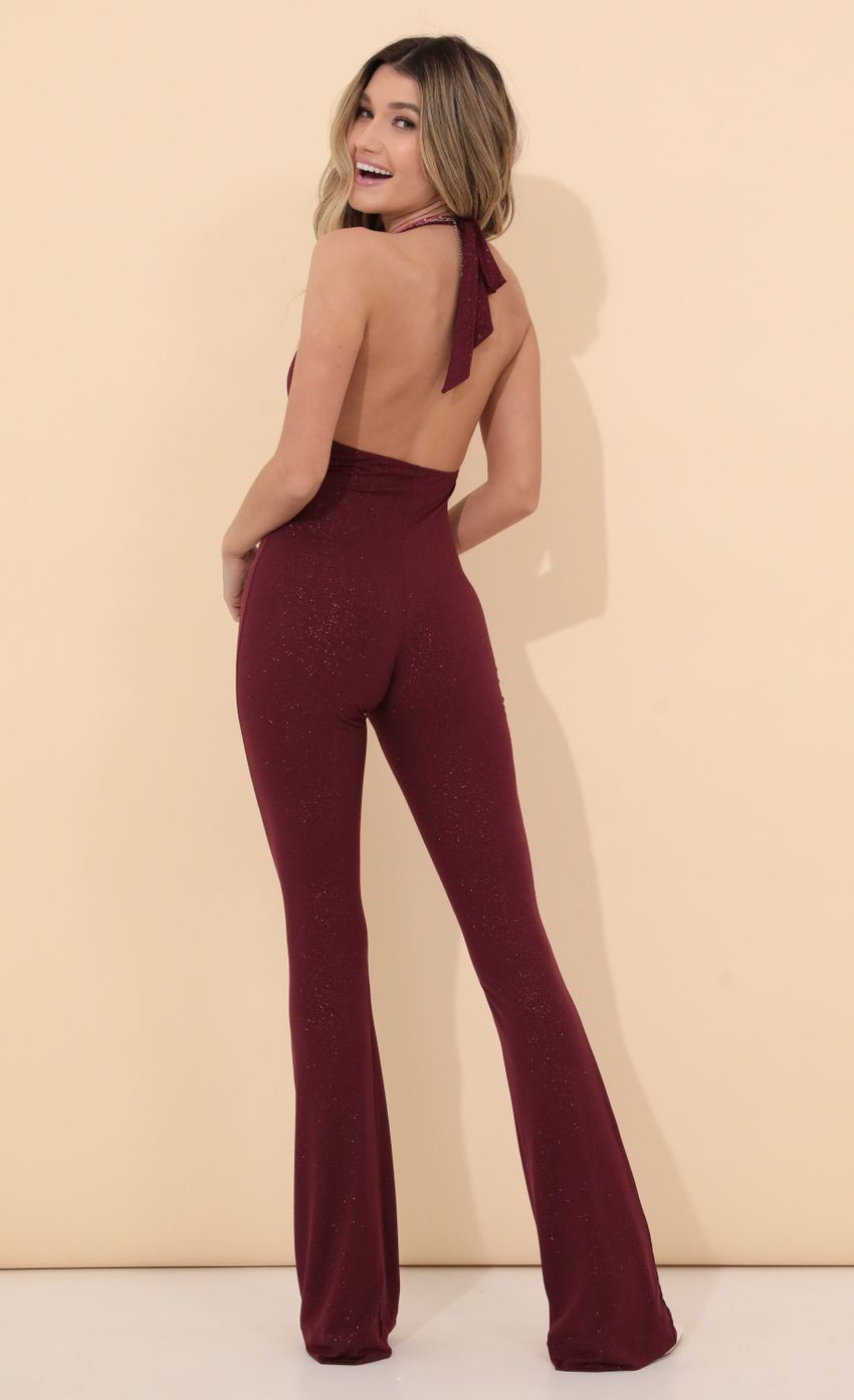 Picture Shimmer Jumpsuit in Burgundy. Source: https://media-img.lucyinthesky.com/data/Jan22_2/850xAUTO/1V9A49371.JPG
