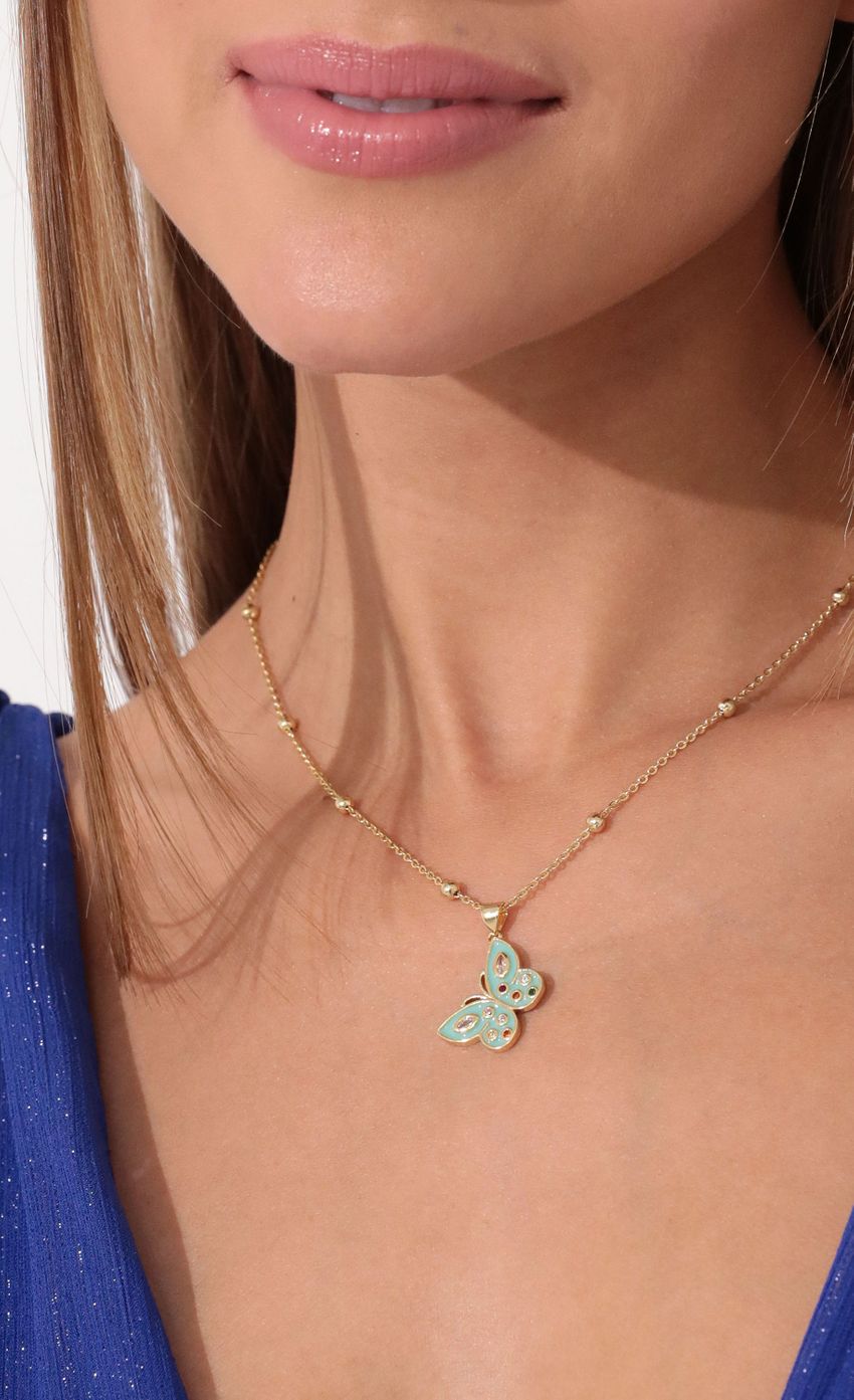 Picture You Make My Heart Flutter Necklace in Gold. Source: https://media-img.lucyinthesky.com/data/Jan22_2/850xAUTO/2V9A22131.JPG