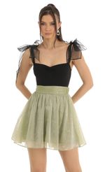Picture Skater Skirt in Black. Source: https://media-img.lucyinthesky.com/data/Jan23/150xAUTO/d1abb0f8-06ba-4712-a1d1-275a982b8bfe.jpg