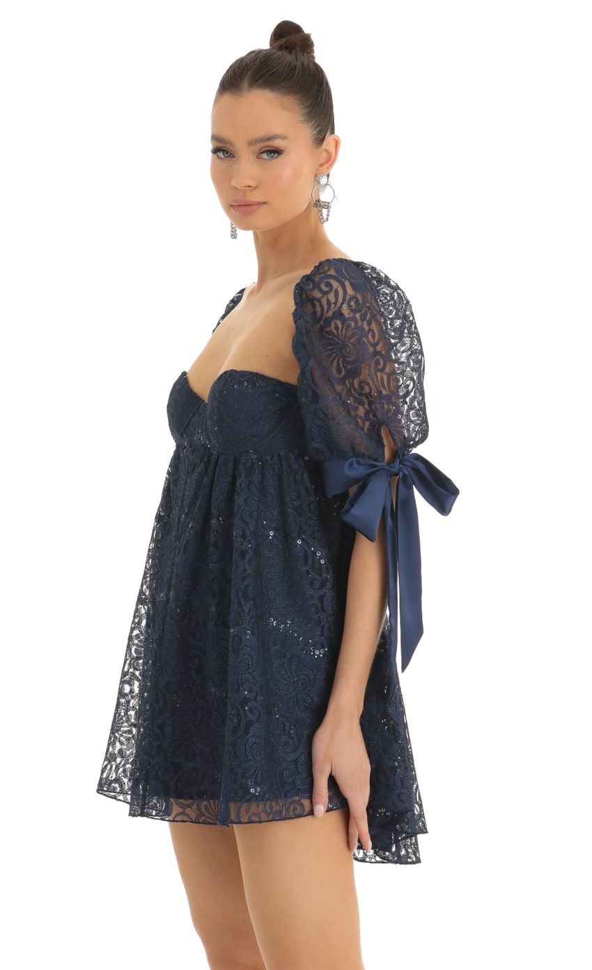 Picture Sequin Lace Baby Doll Dress in Dark Blue. Source: https://media-img.lucyinthesky.com/data/Jan23/850xAUTO/03b591f4-c5ee-4342-842f-a8b776b773de.jpg