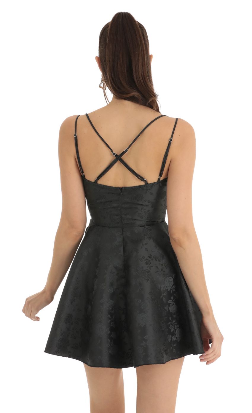 Picture Floral Jacquard Cross Back Dress in Black. Source: https://media-img.lucyinthesky.com/data/Jan23/850xAUTO/07fd50a1-cdd8-4b15-aab8-9df5721cfbf2.jpg