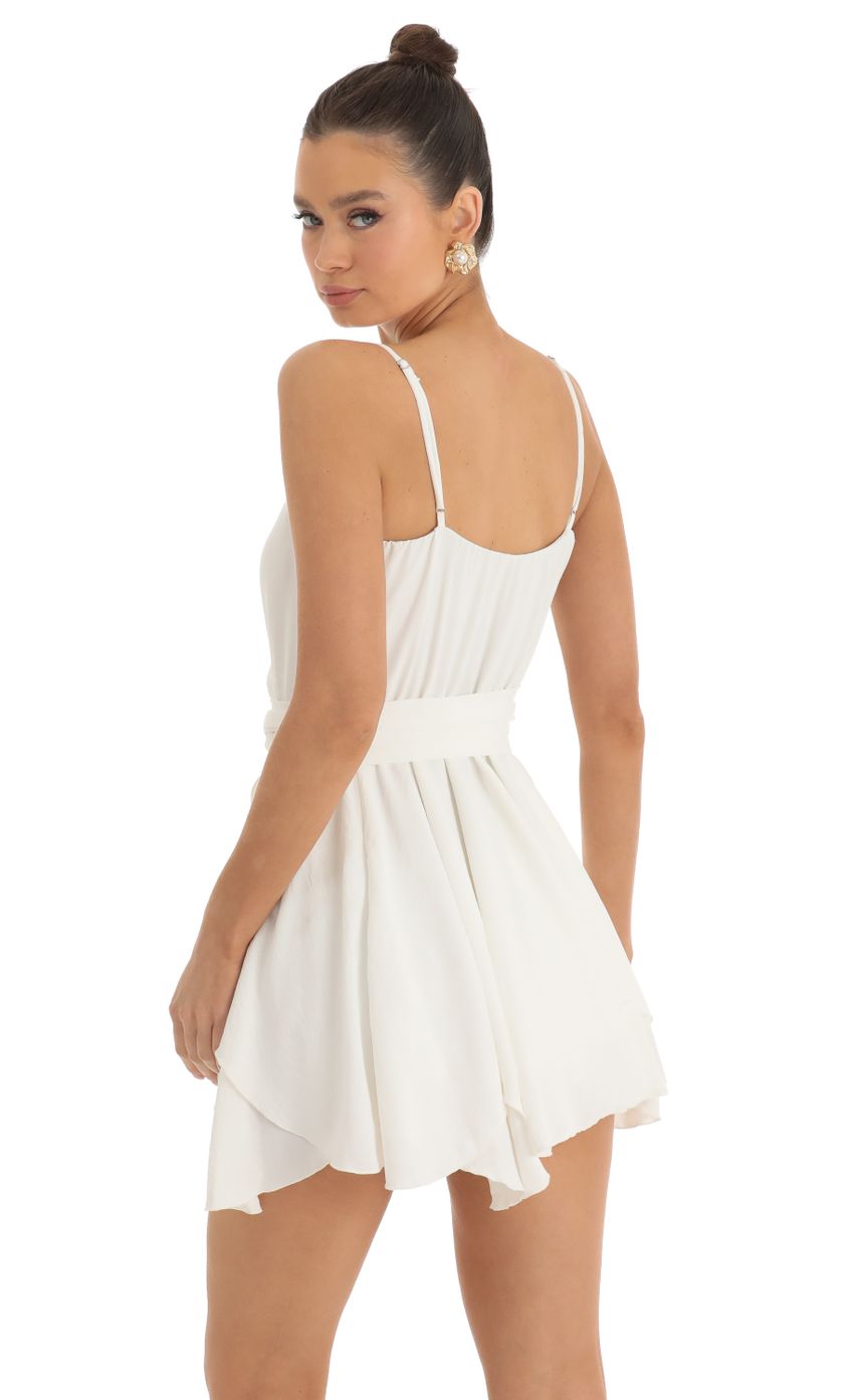 Picture Wrap Skater Dress in Ivory. Source: https://media-img.lucyinthesky.com/data/Jan23/850xAUTO/0bc8682b-b512-4056-9c44-9464cd3b806d.jpg
