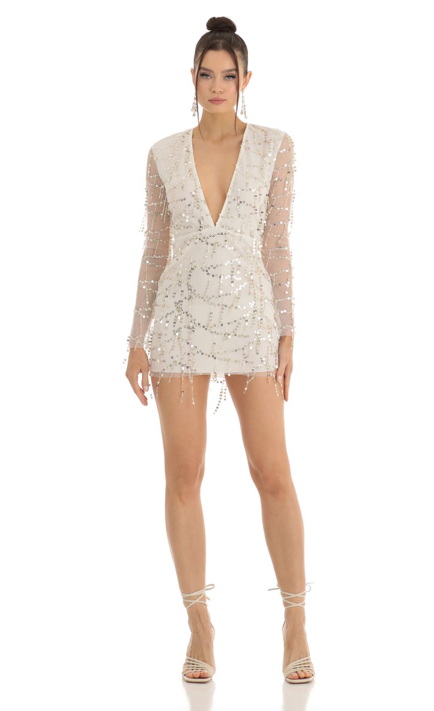 Picture Dangling Sequin Plunge Dress in White. Source: https://media-img.lucyinthesky.com/data/Jan23/850xAUTO/0d128c38-f8c0-4bb3-aa42-247209c1f3e1.jpg