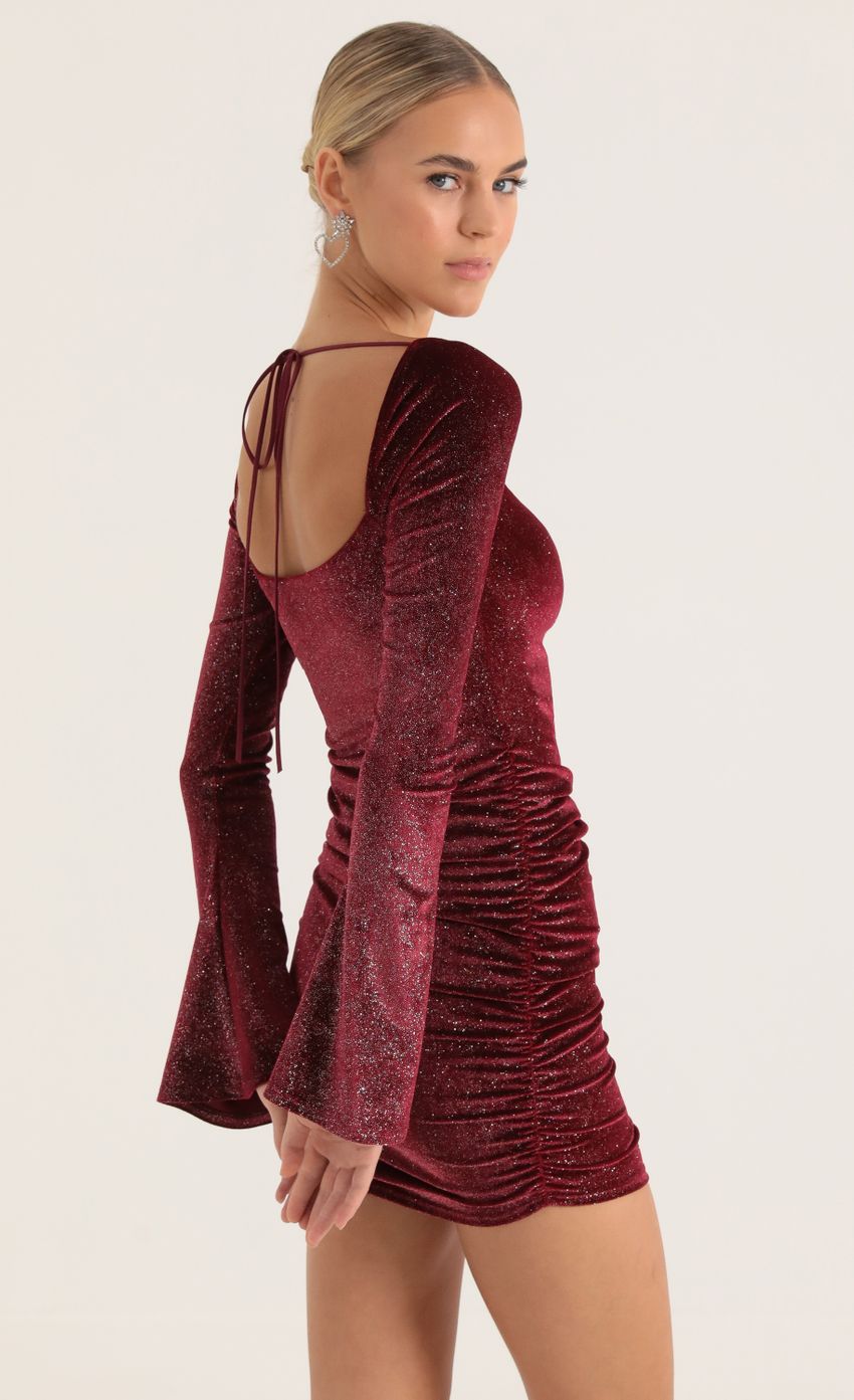 Picture Glitter Velvet Bell Sleeve Dress in Red. Source: https://media-img.lucyinthesky.com/data/Jan23/850xAUTO/13268aaa-c0cd-4bd4-ada7-bd8974063d56.jpg