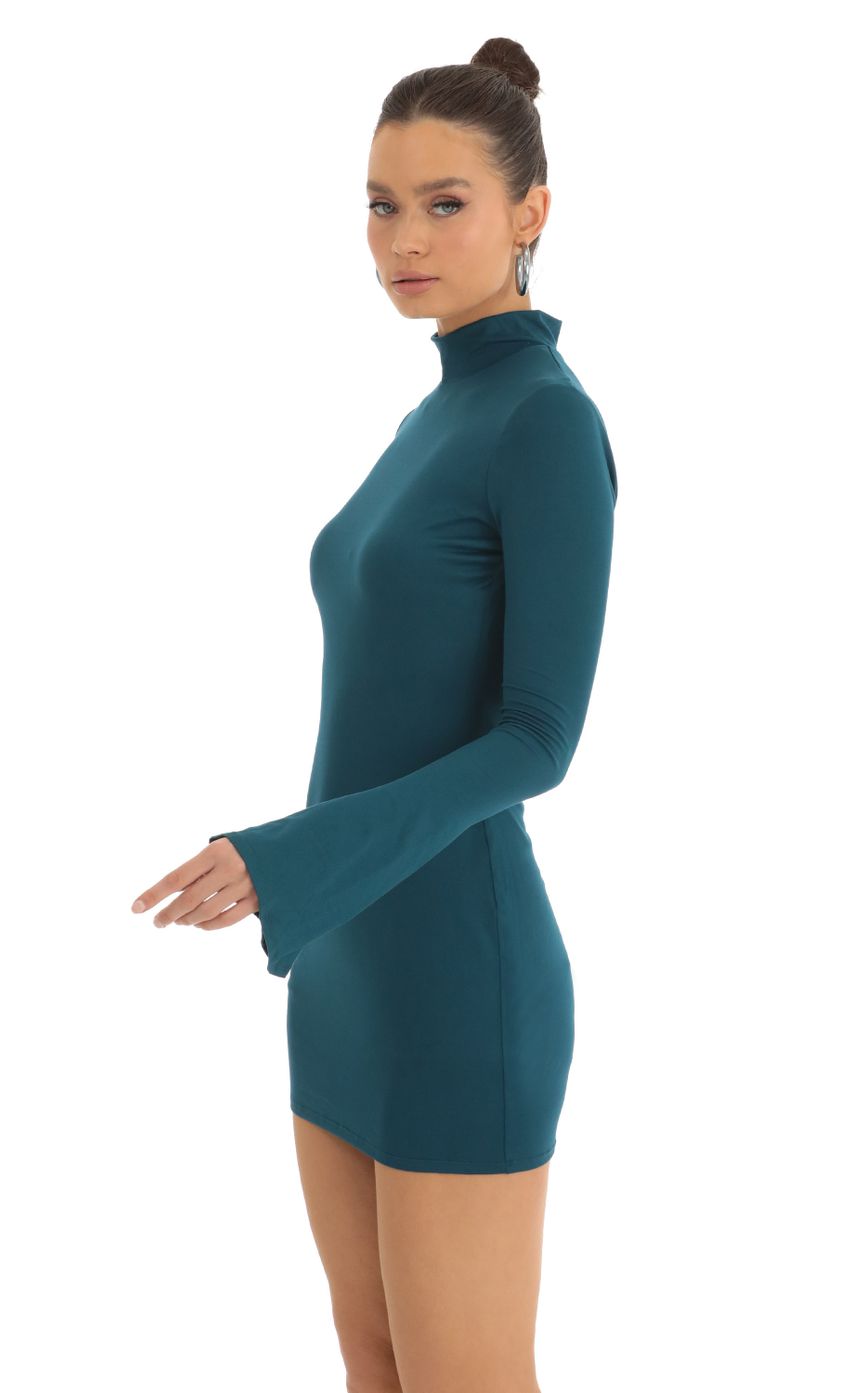 Picture Long Sleeve Mock Neck Dress in Turquoise. Source: https://media-img.lucyinthesky.com/data/Jan23/850xAUTO/256f8402-e53b-4fbf-9ec3-fe78aca39e10.jpg