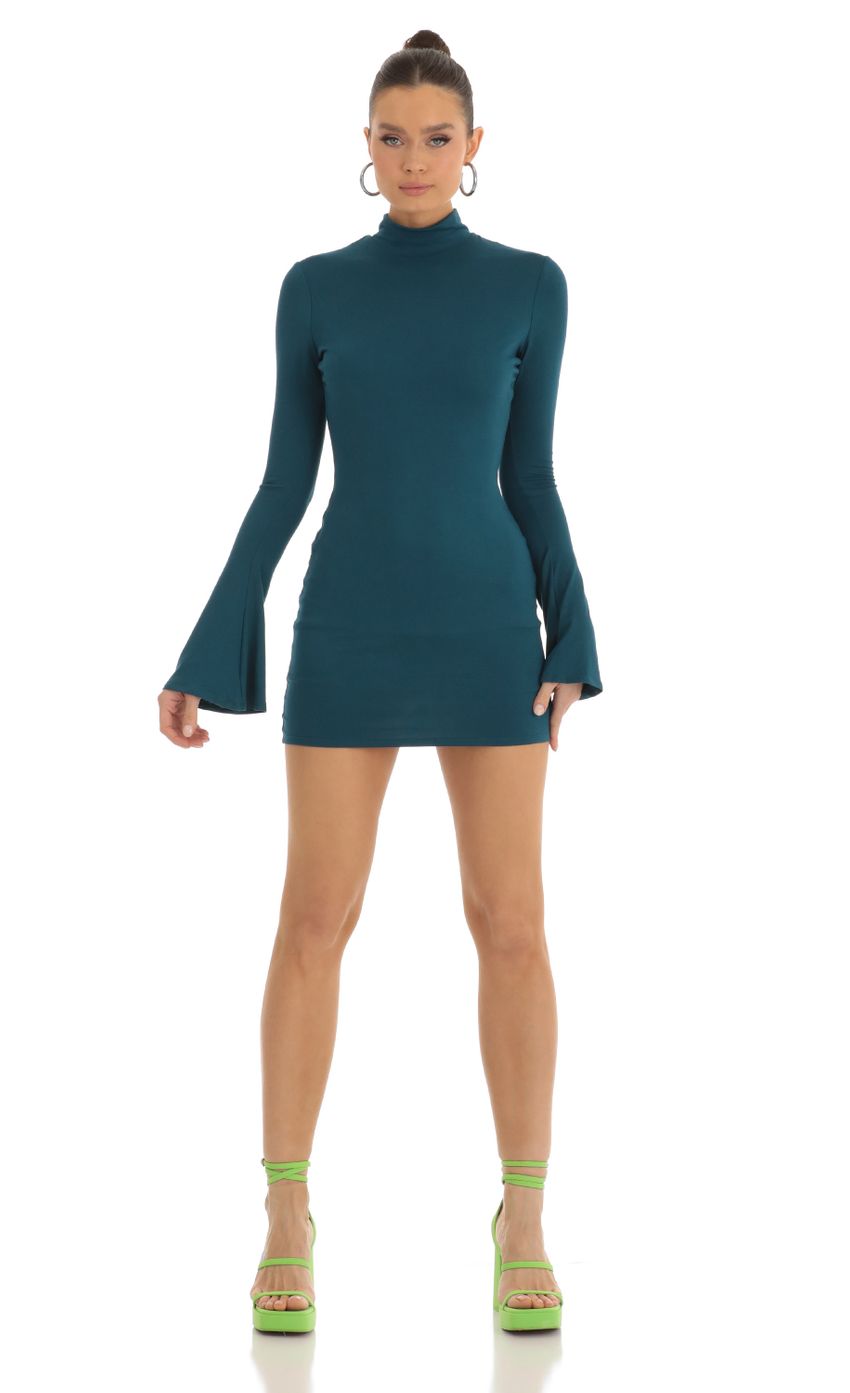 Picture Long Sleeve Mock Neck Dress in Turquoise. Source: https://media-img.lucyinthesky.com/data/Jan23/850xAUTO/367a4d2b-d0c4-48bd-bb4a-2dc865d68997.jpg