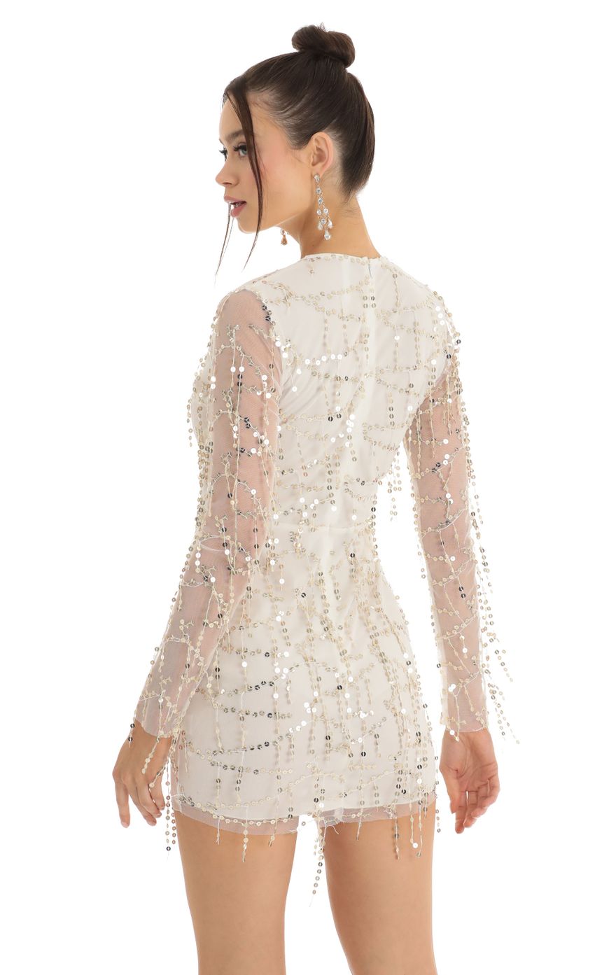 Picture Dangling Sequin Plunge Dress in White. Source: https://media-img.lucyinthesky.com/data/Jan23/850xAUTO/3ac30f2c-250e-4db9-9303-c0e30ee299a3.jpg