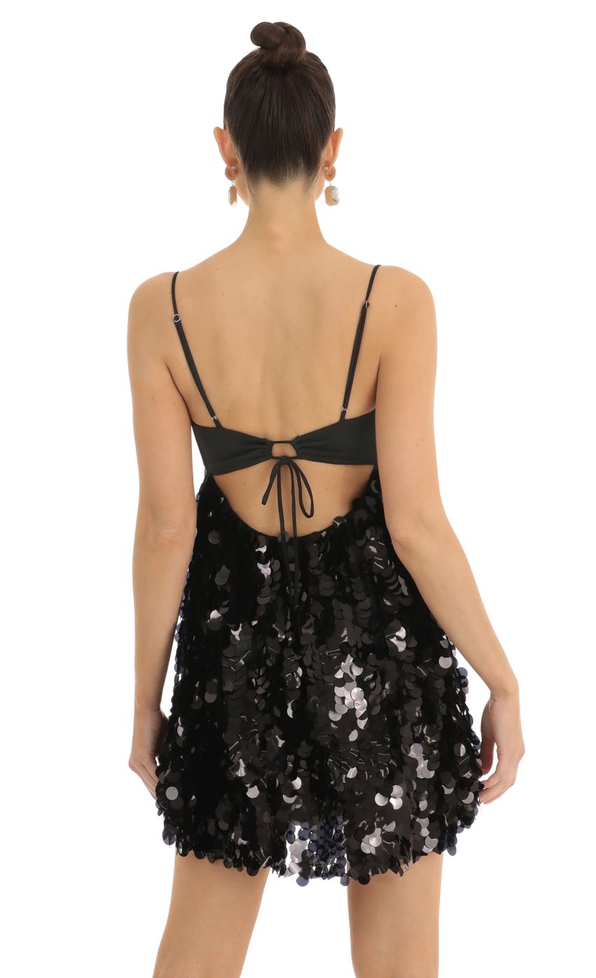 Picture Big Sequin Keyhole Baby Doll Dress is Black. Source: https://media-img.lucyinthesky.com/data/Jan23/850xAUTO/629965e7-09a5-4ae5-a8fb-142dc496d6a2.jpg