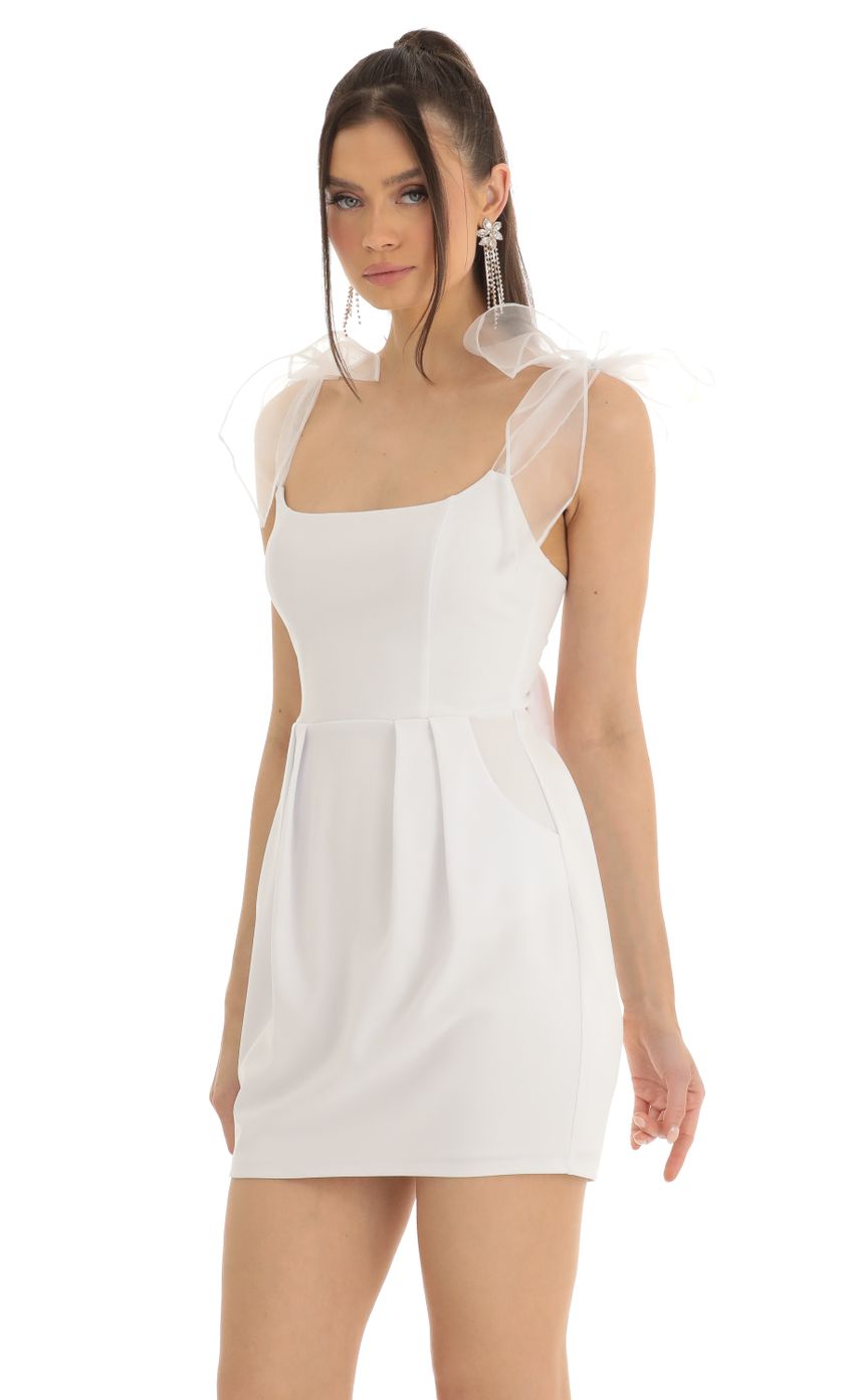 Picture Bow Mini Dress in White. Source: https://media-img.lucyinthesky.com/data/Jan23/850xAUTO/6a0e5e08-b037-455f-bb00-e87c515d0193.jpg