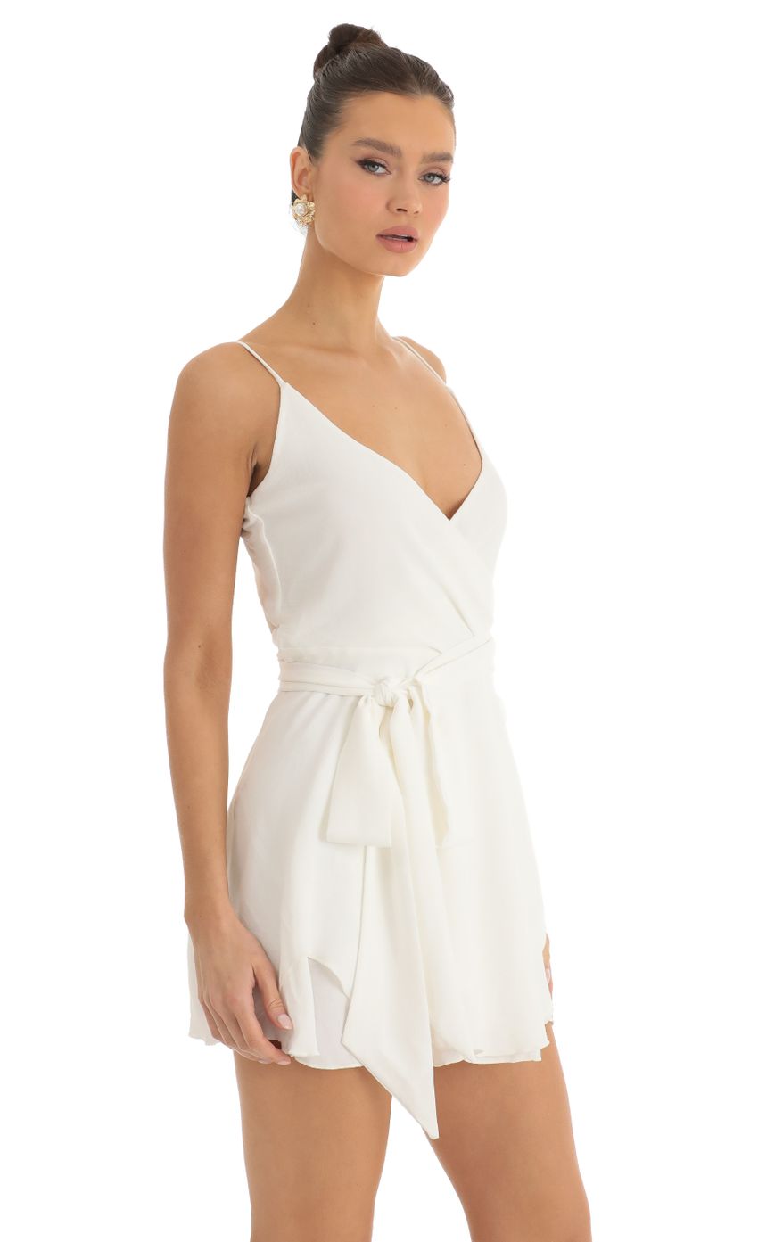 Picture Wrap Skater Dress in Ivory. Source: https://media-img.lucyinthesky.com/data/Jan23/850xAUTO/6e0607eb-1f8f-4db4-aa3e-34ff5d1e957d.jpg