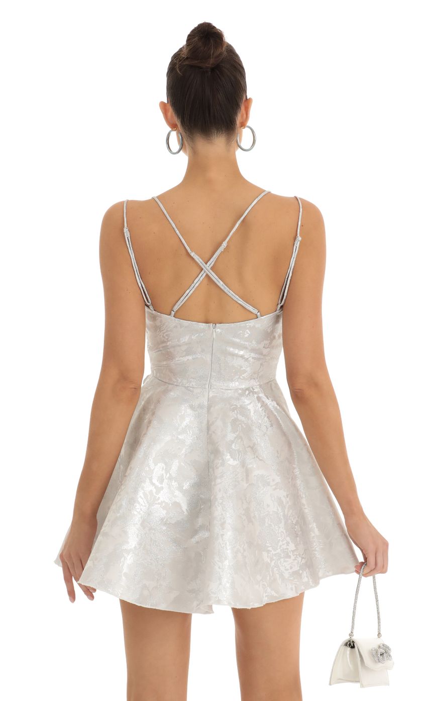 Picture Glitter Jacquard Cross Back Dress in Silver. Source: https://media-img.lucyinthesky.com/data/Jan23/850xAUTO/74017539-083a-4d4d-8ca4-1e8fbb83649b.jpg