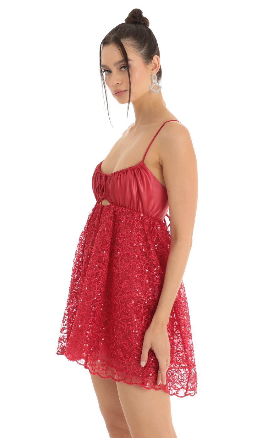 Picture Sequin Embroidered Baby Doll Dress in Red. Source: https://media-img.lucyinthesky.com/data/Jan23/850xAUTO/9178160e-797b-45de-bb27-446789f9888c.jpg