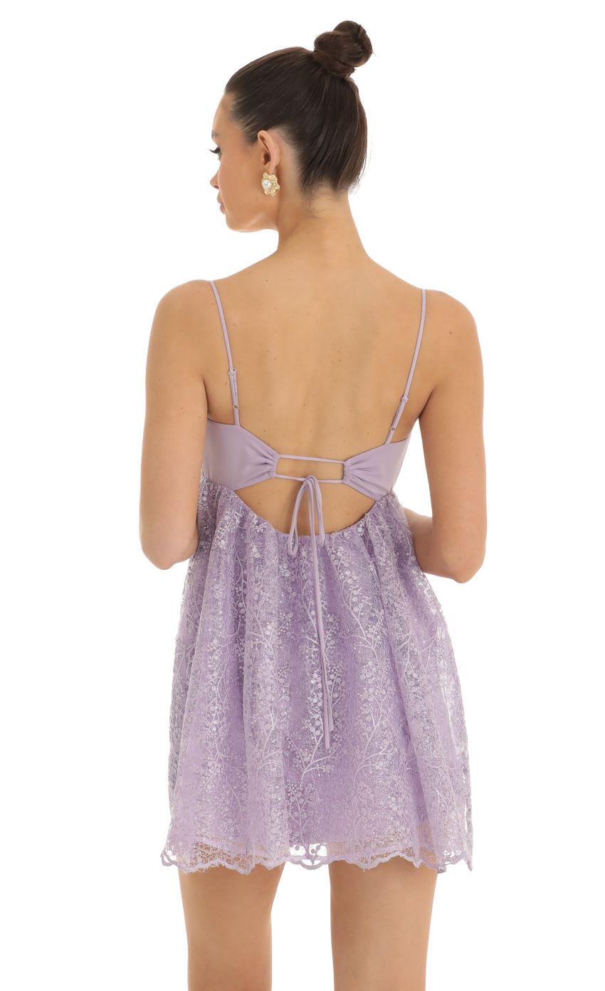 Picture Sequin Embroidered Baby Doll Dress in Purple. Source: https://media-img.lucyinthesky.com/data/Jan23/850xAUTO/9808ec27-7b3d-4291-9810-fec077578a8a.jpg