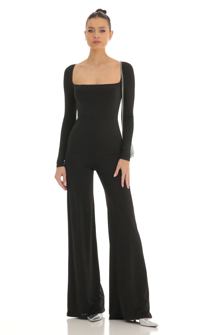 Picture Open Back Long Sleeve Jumpsuit in Black. Source: https://media-img.lucyinthesky.com/data/Jan23/850xAUTO/b1bd5862-1ffd-4940-b256-07a380bbe0a2.jpg