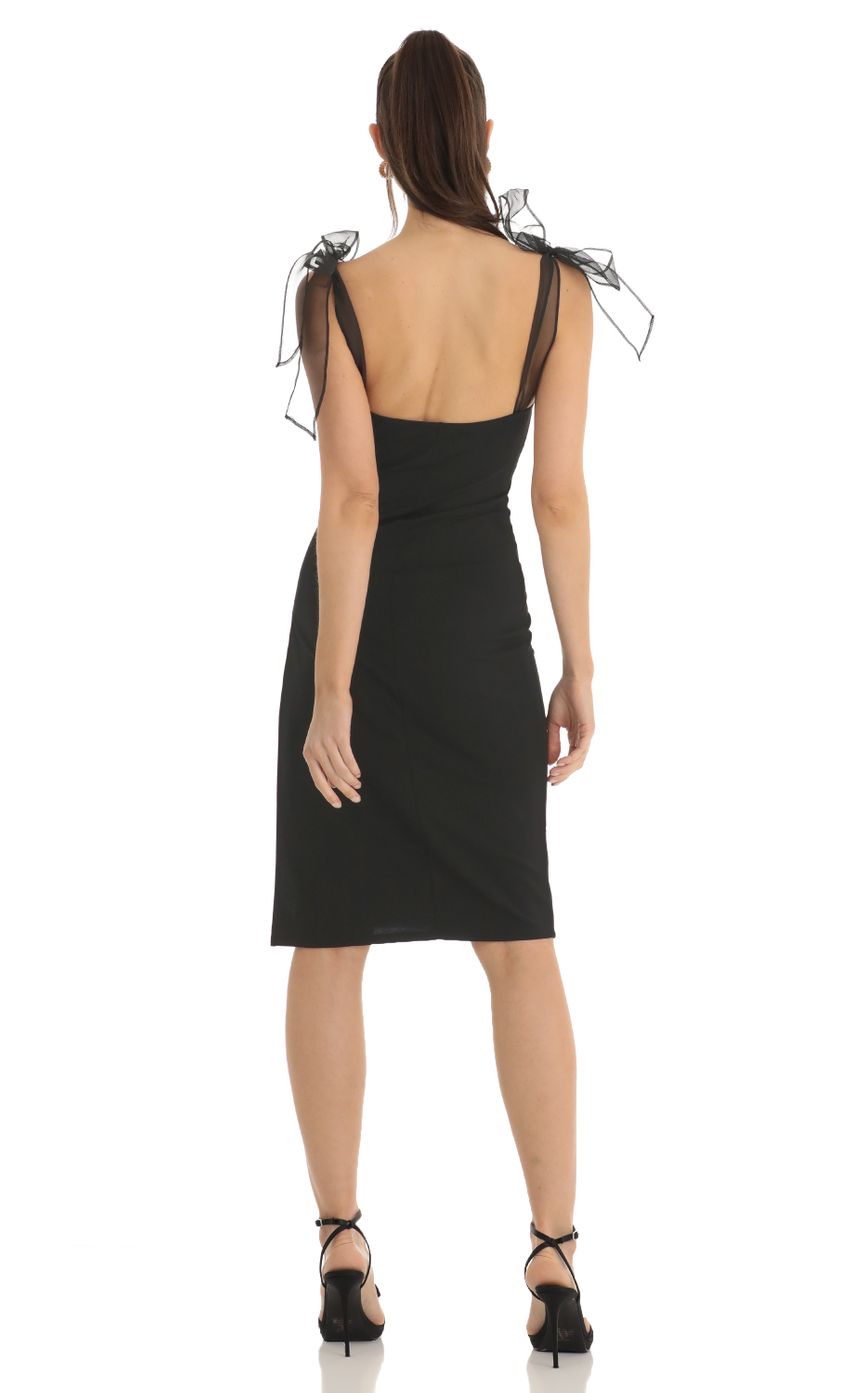 Picture Shoulder Bow Tie Crepe Midi Dress in Black. Source: https://media-img.lucyinthesky.com/data/Jan23/850xAUTO/d13dab24-b3c8-4ced-b2eb-9c72483e4b2e.jpg