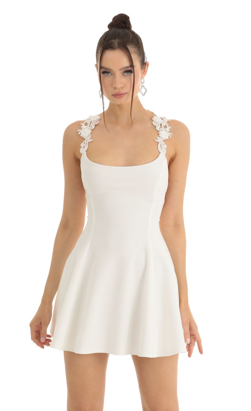 Picture Floral Strap Crepe Flare Dress in White. Source: https://media-img.lucyinthesky.com/data/Jan23/850xAUTO/daca56cd-b0d5-4117-9da7-3b26e9c99cef.jpg