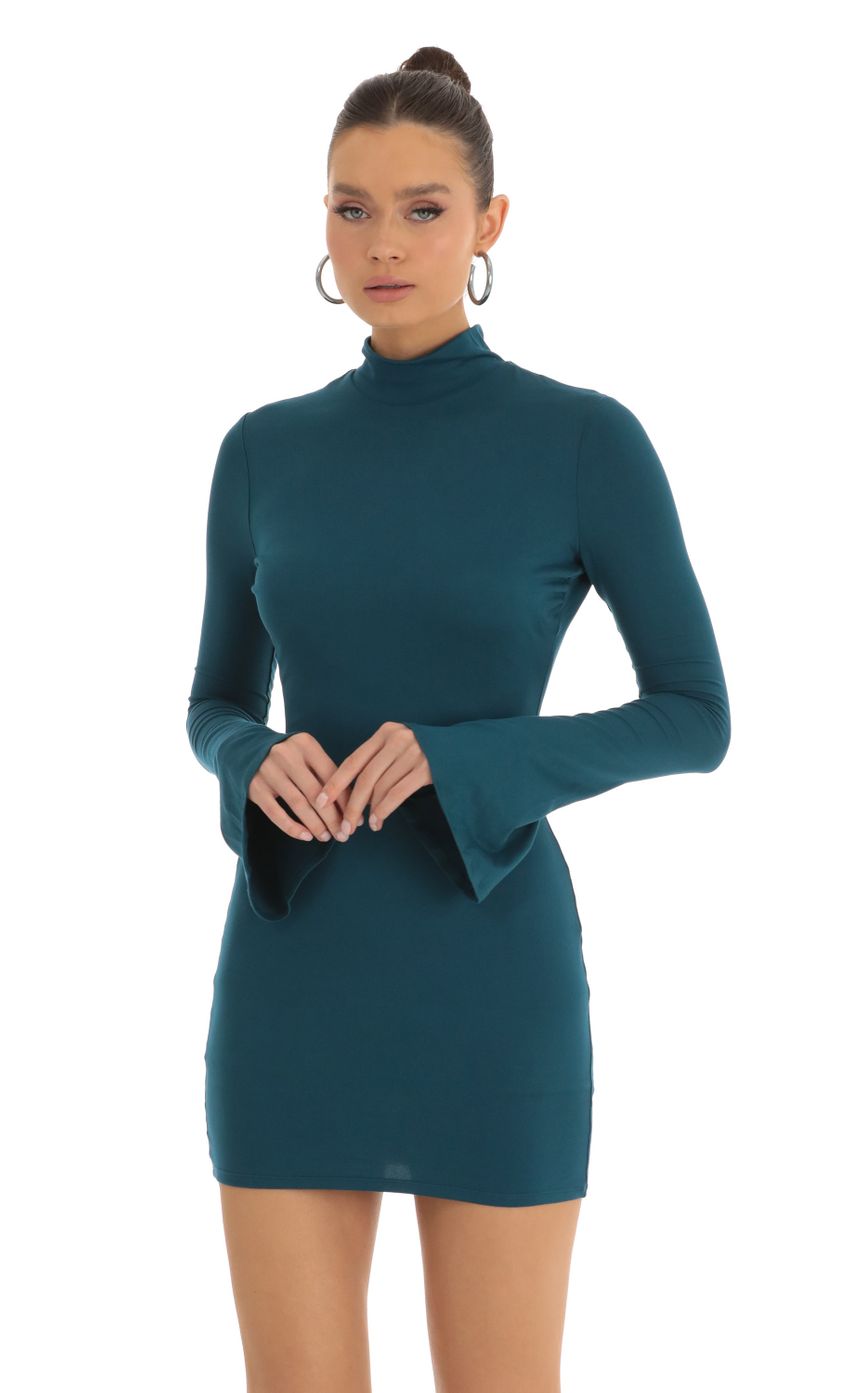 Picture Long Sleeve Mock Neck Dress in Turquoise. Source: https://media-img.lucyinthesky.com/data/Jan23/850xAUTO/e0786563-9305-4456-807d-b47a4cc43d88.jpg