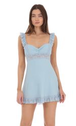 Picture Lace Strap Ruffle Dress in Blue. Source: https://media-img.lucyinthesky.com/data/Jan24/150xAUTO/0afe5d0e-d9ae-4138-a168-376f6cd6d2f5.jpg