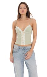 Picture Lace Bow Top in Sage. Source: https://media-img.lucyinthesky.com/data/Jan24/150xAUTO/6751bc03-df08-4ff0-87ec-94aac79b68ff.jpg