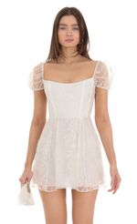 Picture Margie Glitter Puff Sleeve Dress in White. Source: https://media-img.lucyinthesky.com/data/Jan24/150xAUTO/739930b8-fc73-432d-95f8-adb7f65094db.jpg
