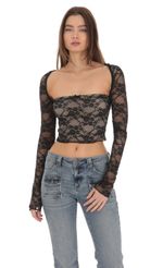 Picture Elianna Lace Top in Black. Source: https://media-img.lucyinthesky.com/data/Jan24/150xAUTO/79028ec4-0026-4e6f-935d-e7fd78f74937.jpg