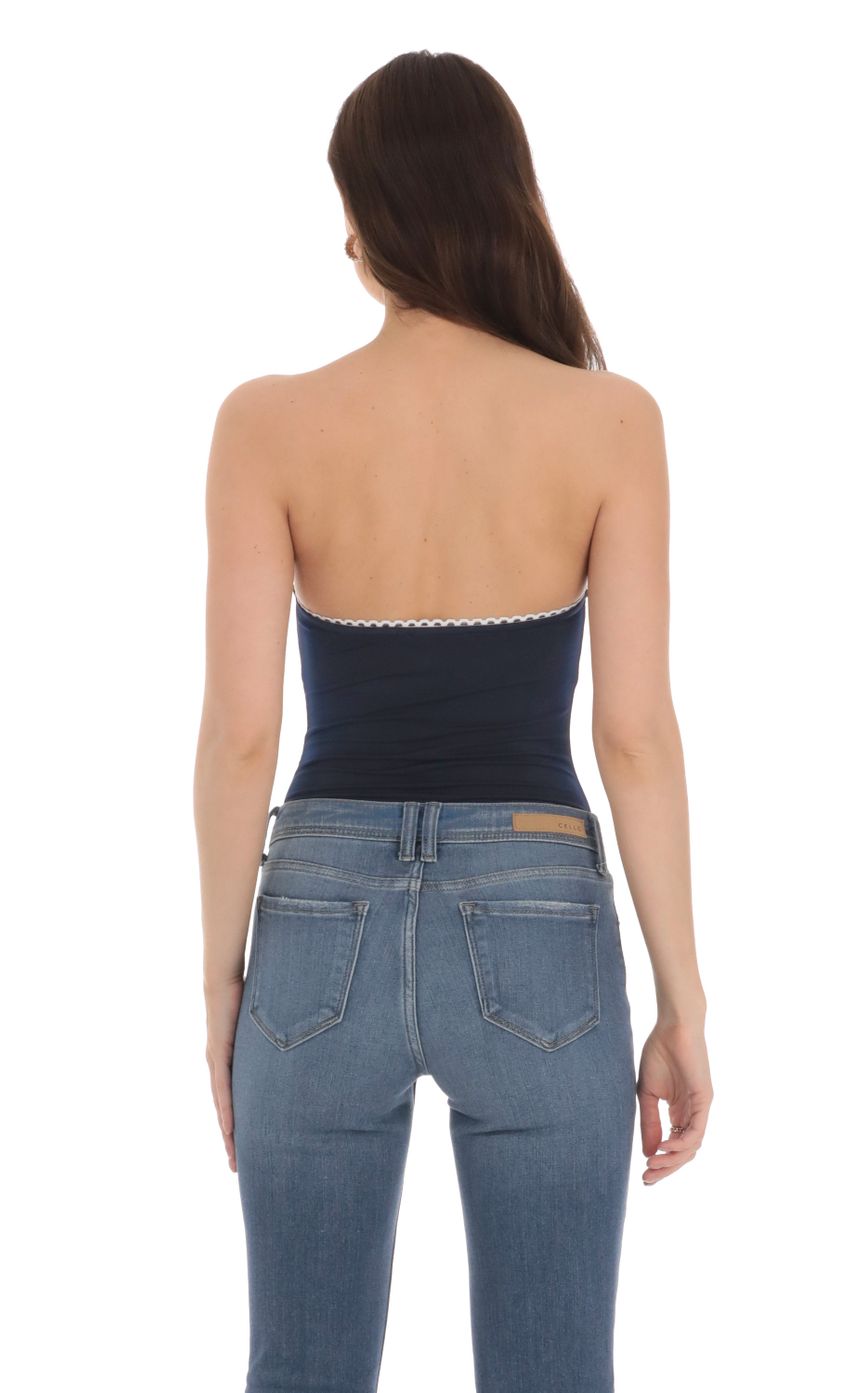 Picture Strapless White Accent Bodysuit in Navy. Source: https://media-img.lucyinthesky.com/data/Jan24/850xAUTO/0477f5b5-07ad-4015-9c62-3e18b0c49027.jpg
