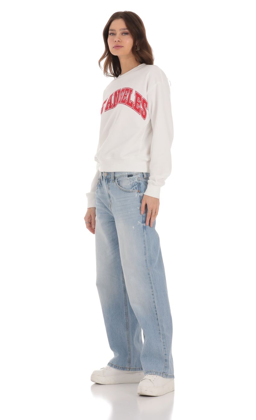 Picture Wide Leg Jeans in Faded Denim. Source: https://media-img.lucyinthesky.com/data/Jan24/850xAUTO/1042d1fa-3dec-4f28-92c9-23fae8846a6a.jpg