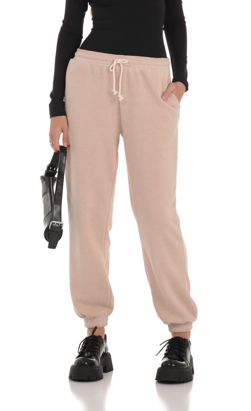Picture Washed Drawstring Sweatpants in Light Brown. Source: https://media-img.lucyinthesky.com/data/Jan24/850xAUTO/1b1fed7e-a3af-45db-ae41-c2fc3db6b865.jpg