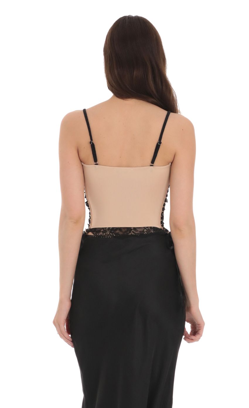 Picture Black Lace Ribbon Top in Tan. Source: https://media-img.lucyinthesky.com/data/Jan24/850xAUTO/1ff1ce13-ef88-4f50-9b84-69d6b93018ad.jpg