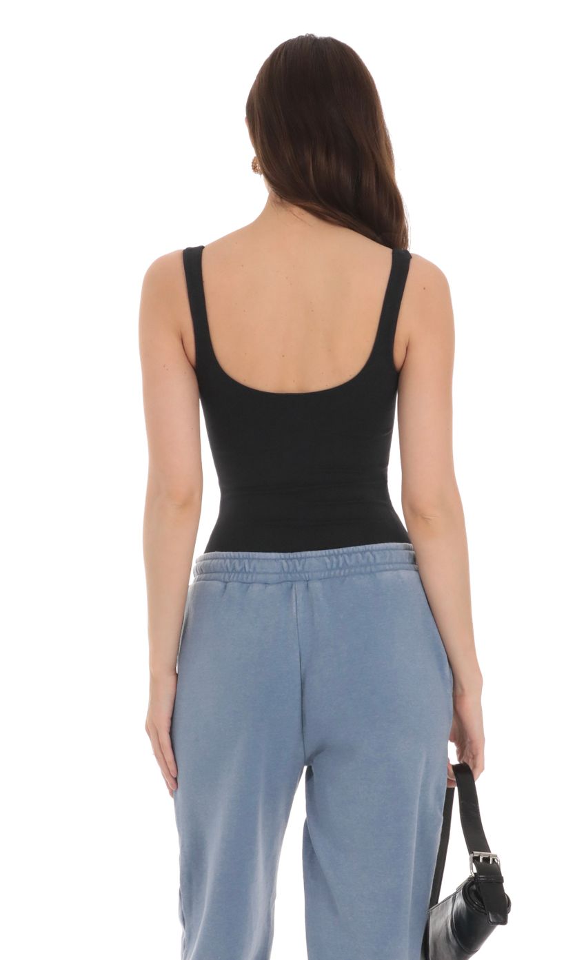 Picture Basic Tank Bodysuit in Black. Source: https://media-img.lucyinthesky.com/data/Jan24/850xAUTO/25e3ad73-d68d-44be-92d4-92496faf2f46.jpg
