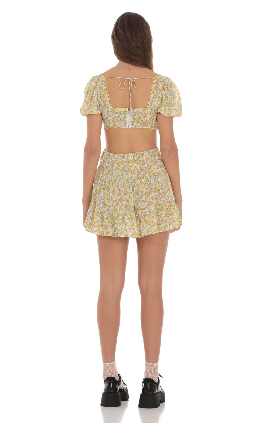 Picture Yellow Floral Cutout Dress in White. Source: https://media-img.lucyinthesky.com/data/Jan24/850xAUTO/2cf1ebfb-96d9-45f4-ae87-93084c52e4ca.jpg