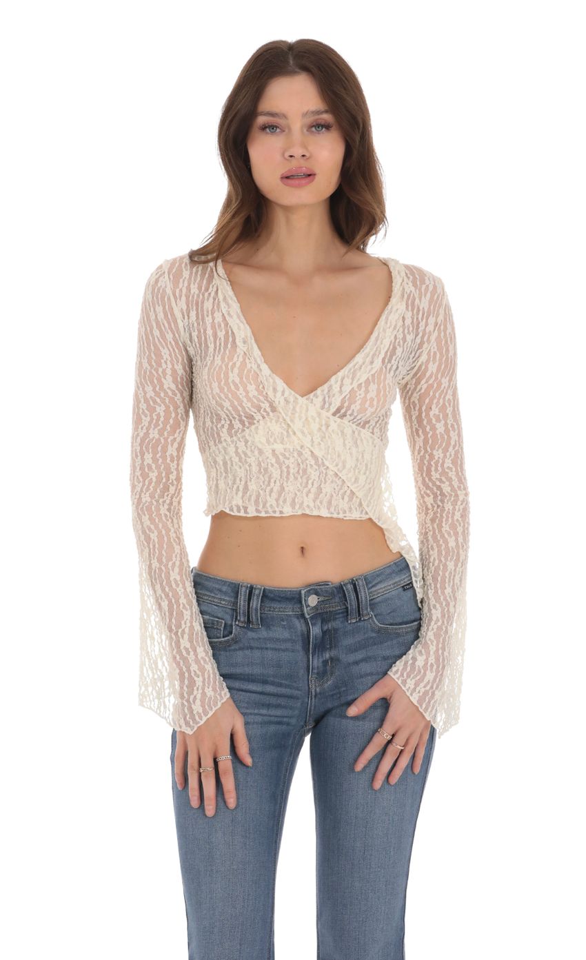 Picture Sheer V-Neck Faux Wrap Top in Vanilla. Source: https://media-img.lucyinthesky.com/data/Jan24/850xAUTO/47432aaf-c60d-4cab-bccc-0f0e82836976.jpg