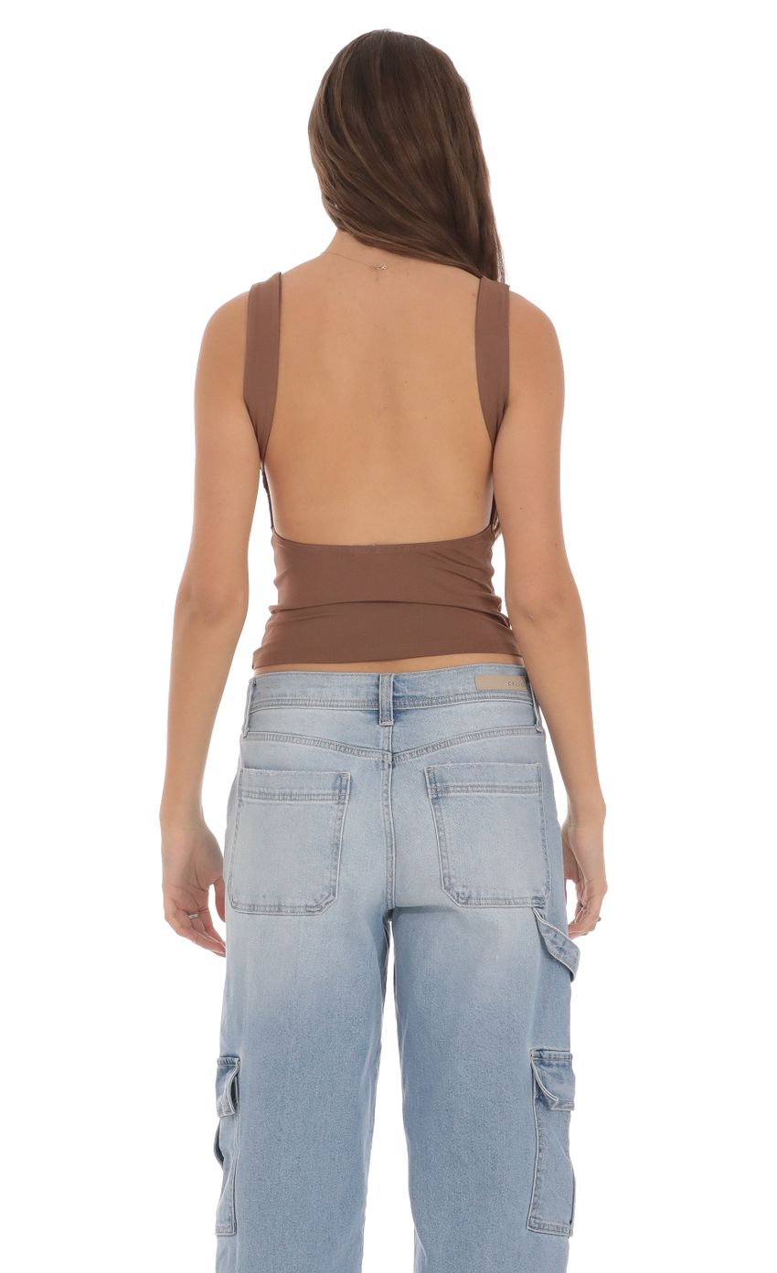 Picture Open Back Tank Top in Brown. Source: https://media-img.lucyinthesky.com/data/Jan24/850xAUTO/73a0c4ed-746c-4ae9-be3c-cf218da493bb.jpg